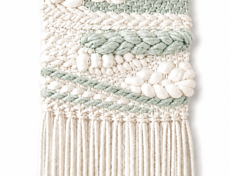Auf dem Bild sieht man einen Mini Wandteppich in beige und mintgrün