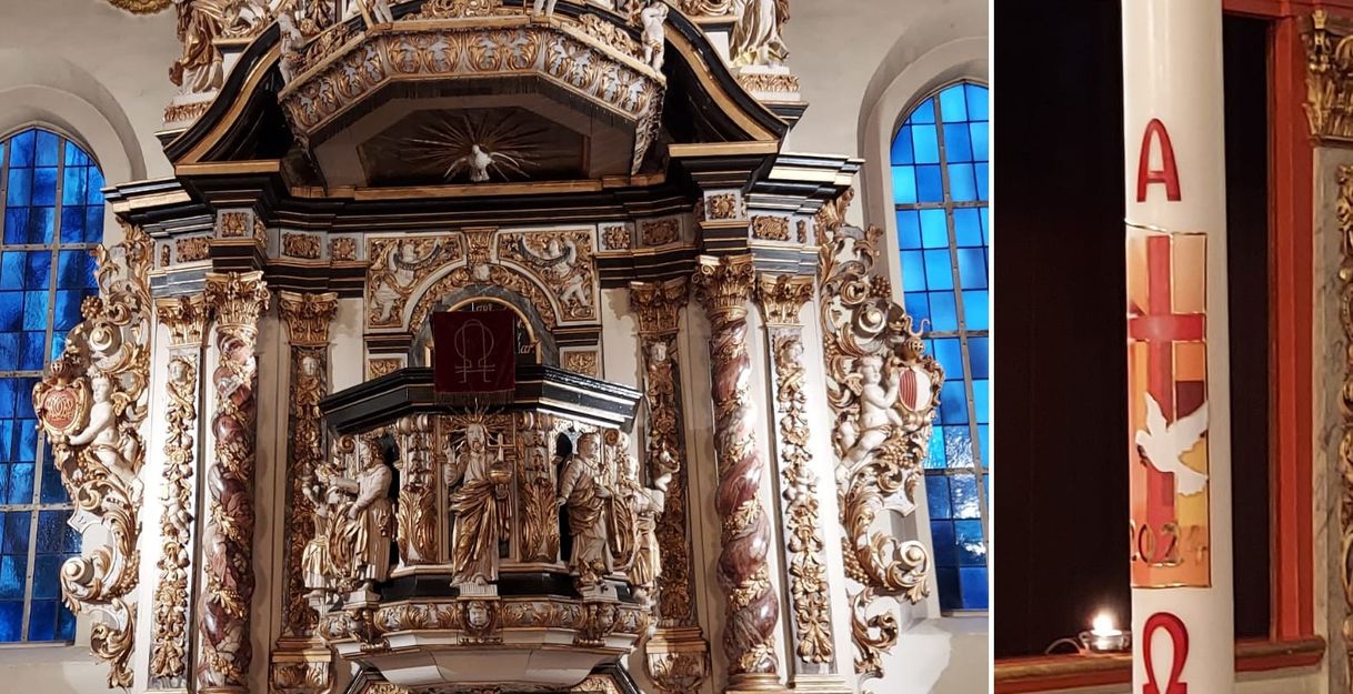 Altar der Schloßkirche mit reich verzierten Figuren und Taufkerze mit christlichen Symbolen.