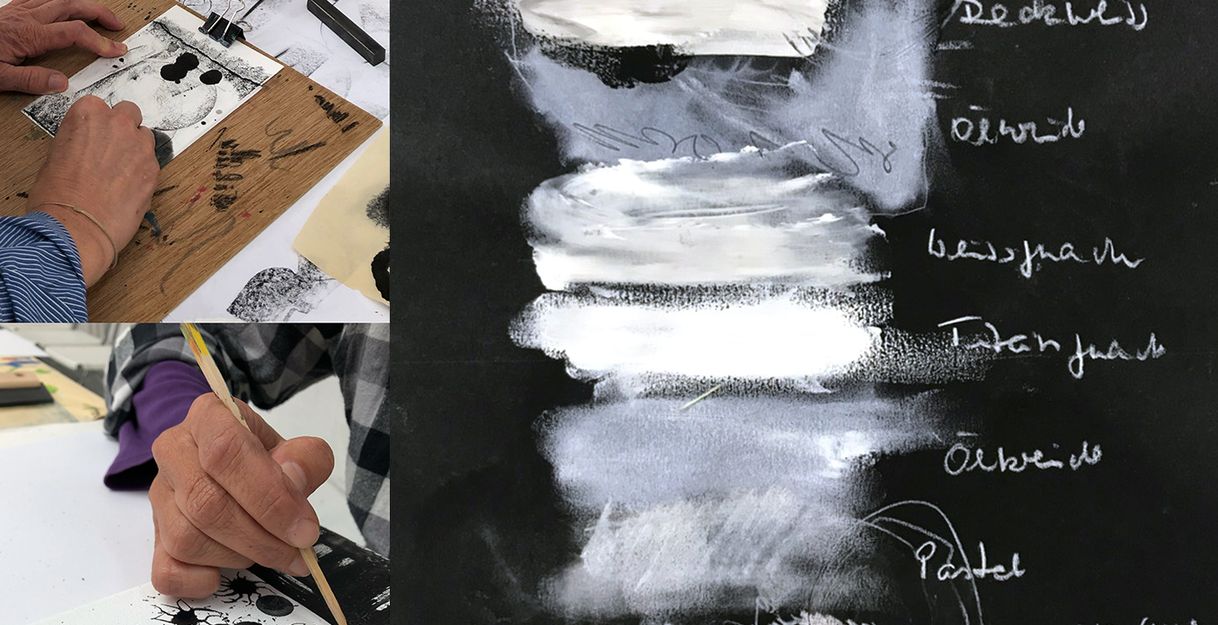 Ausschnitt eines Teilnehmers, der auf kleinem Bild schwarze Farbe aus kratzt, daneben weiße Linien auf schwarzem Papier, die erklären, welche weißen Farben gut darauf haften.