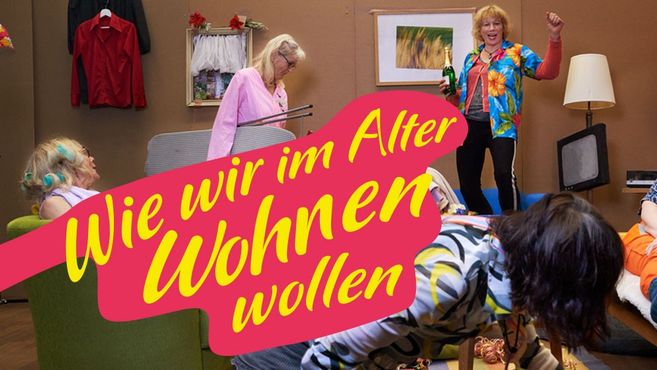 Ältere Menschen in bunter Kleidung bei einem Workshop über Wohnformen im Alter.