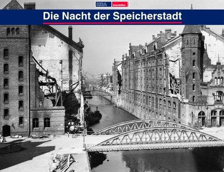 Historische Aufnahme der Hamburger Speicherstadt mit beschädigten Gebäuden und einer Brücke über einen Kanal.