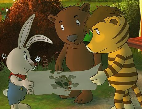 Ein Hase, ein Bär und Tiger schauen gemeinsam auf eine Schatzkarte