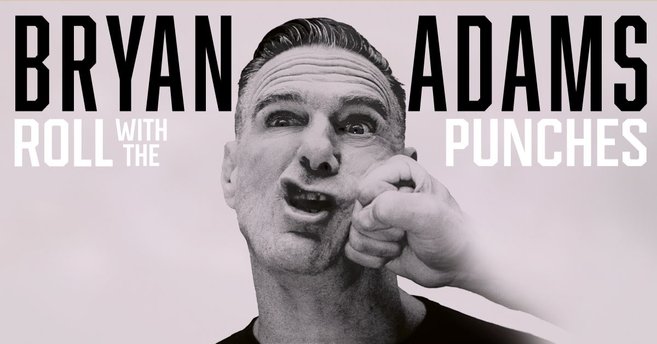 Ein Mann wird humorvoll ins Gesicht geschlagen, umgeben von den Worten 'Bryan Adams Roll With The Punches'.