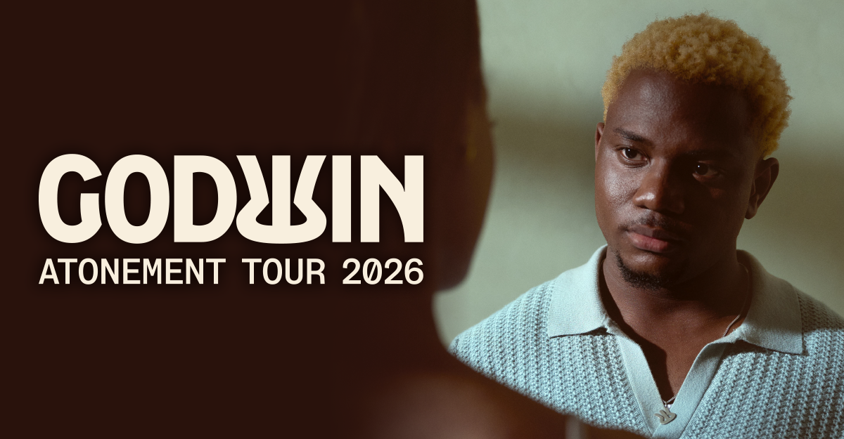Ein Mann mit blondem Haar schaut ernst in die Kamera. Daneben steht der Text 'Godwin Atonement Tour 2026'.