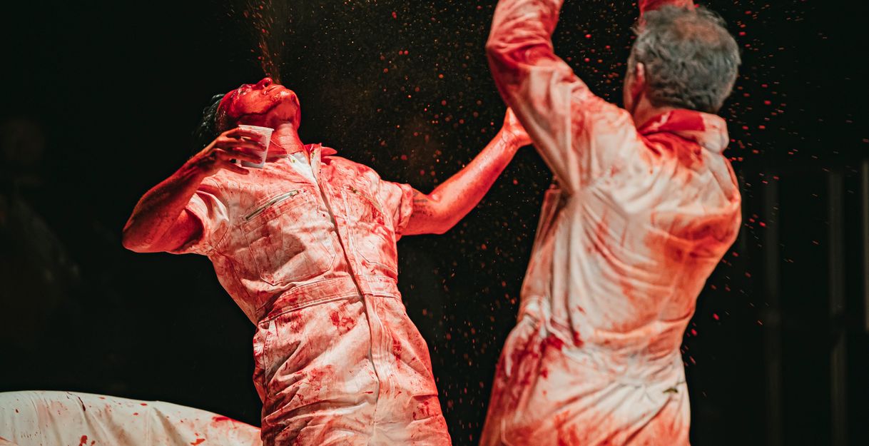 Excerpt from the performance Blood Show by Ocean Hester Stefan Chillingworth. Two performers are shown in close-up.